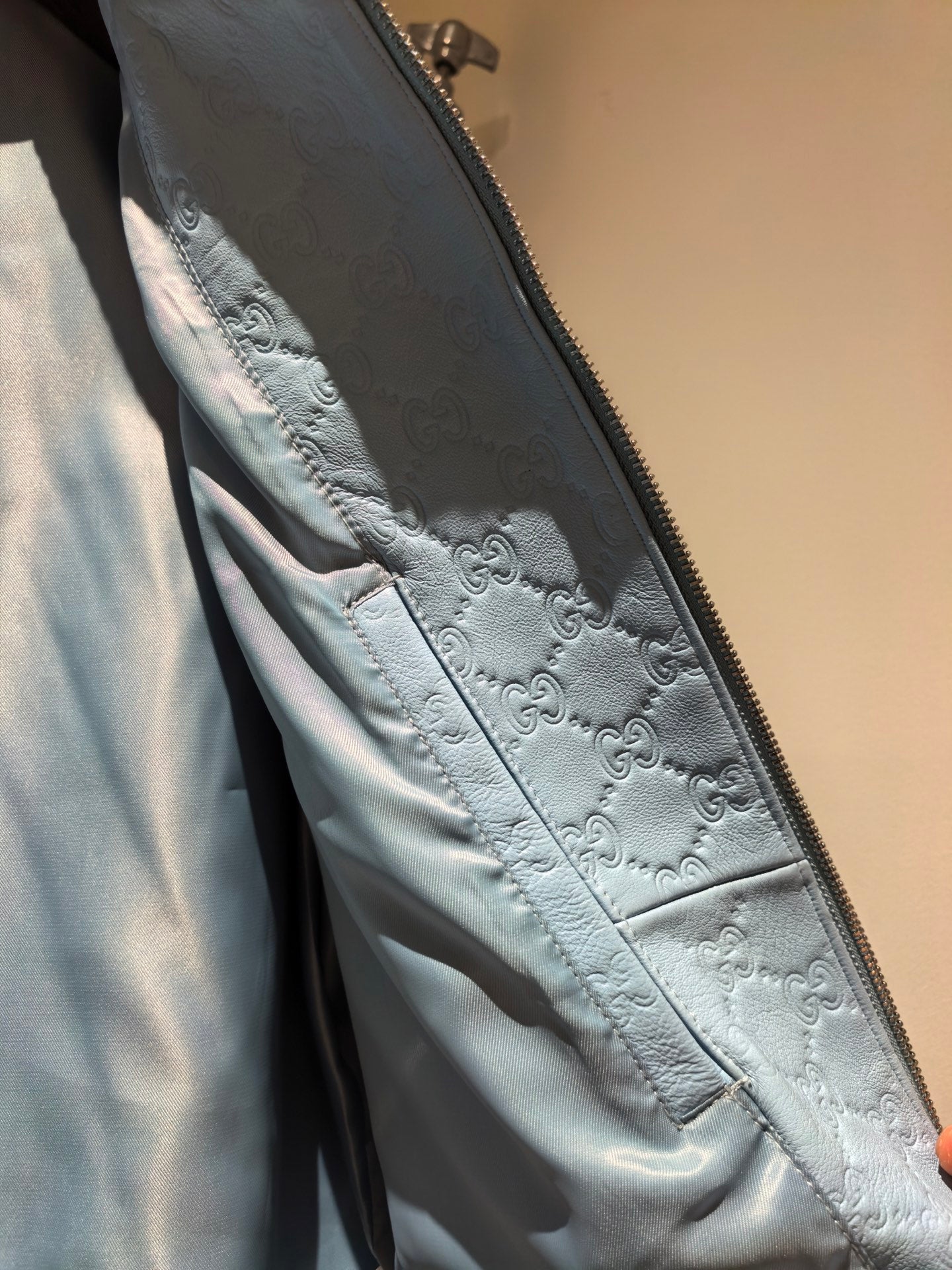 GUCCI GG EMBOSSED LEATHER BOMBER